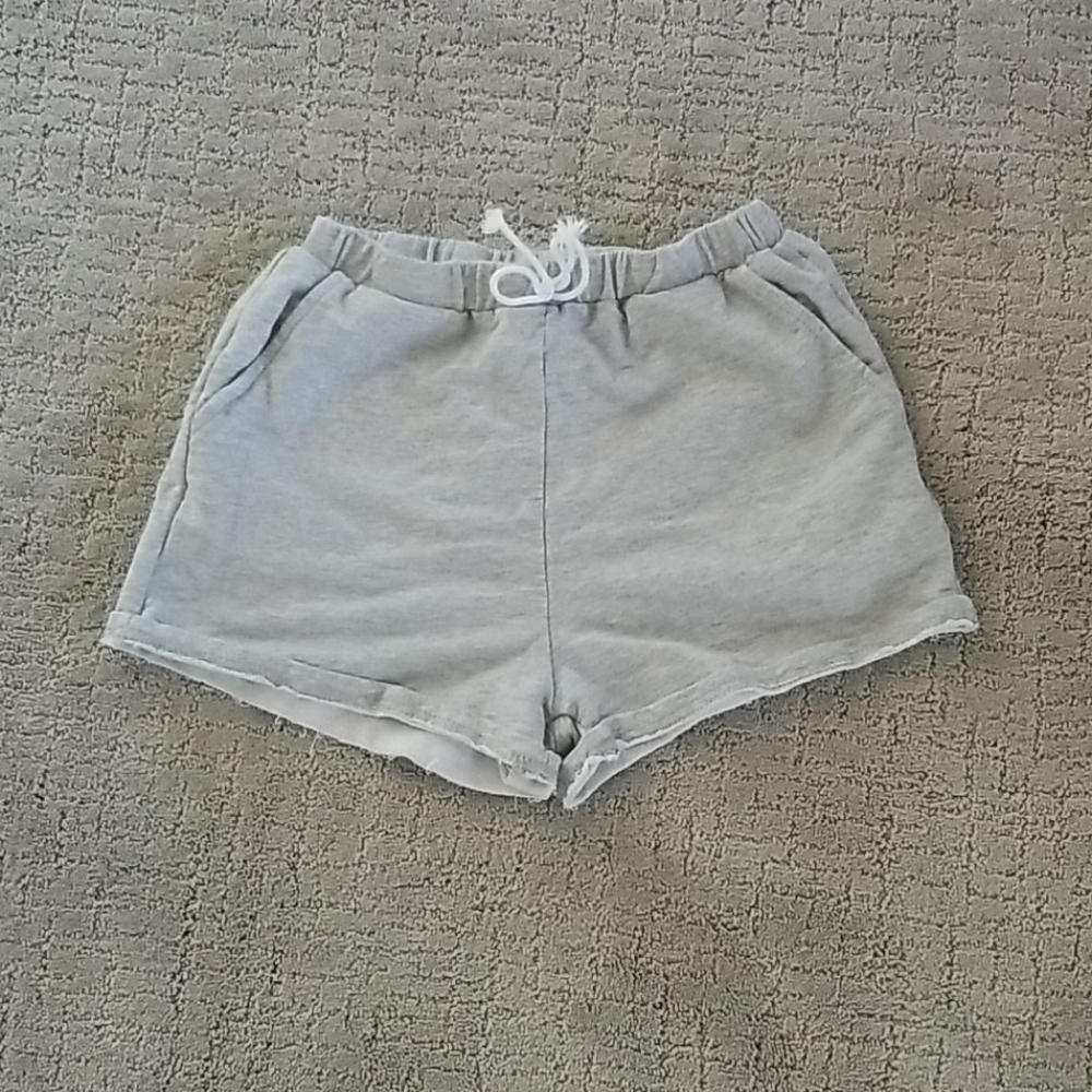 Gray shorts that say junk on the butt.